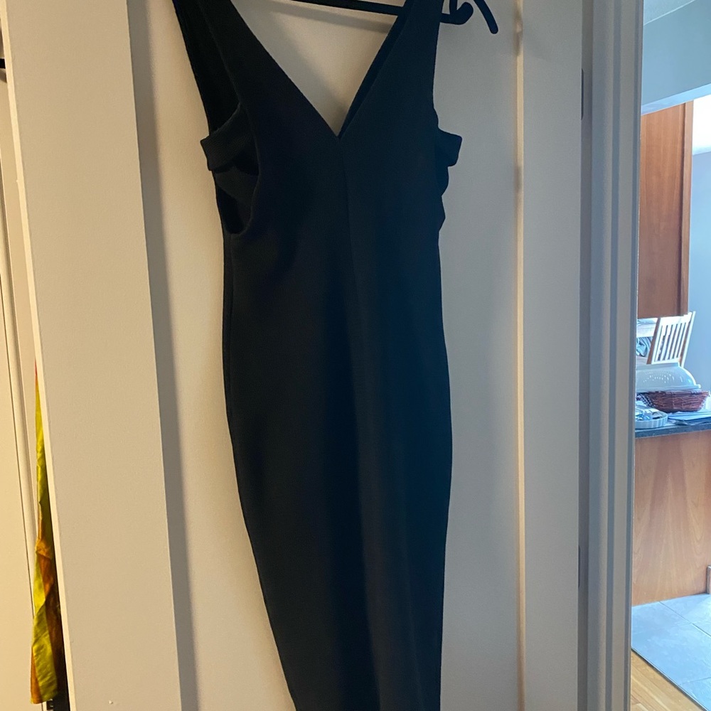 Black jumpsuit. Cut out sides